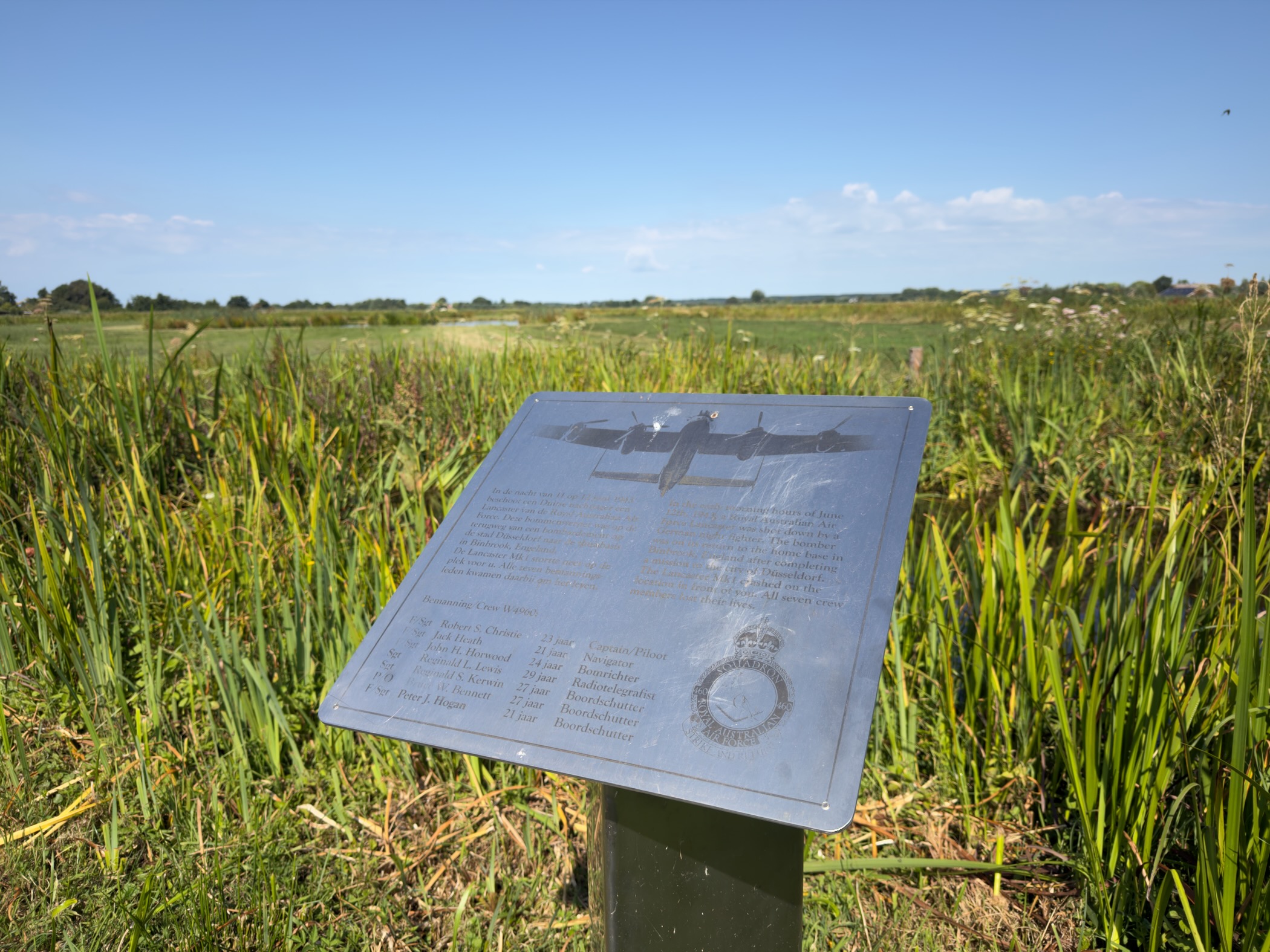 Memorial plaque for the crew of Lancaster bomber W4963, shot down on 12 June 1943, set in a grassy polder