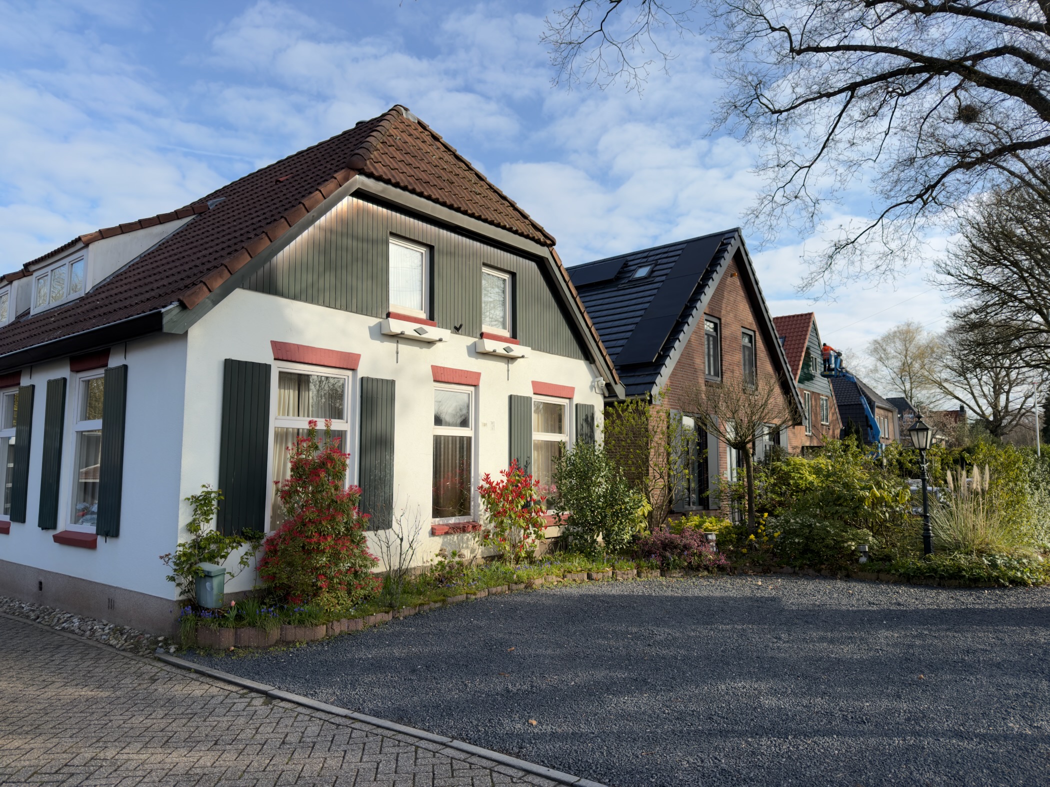 Charming Dutch houses with green shutters and flowering gardens