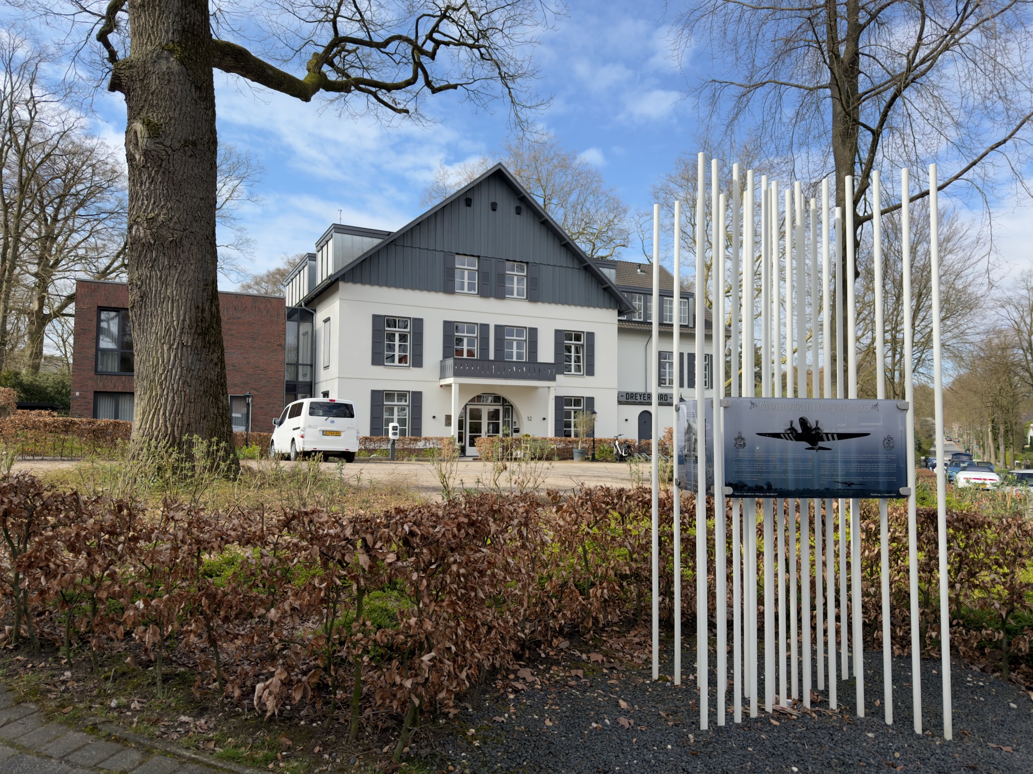 Building with a World War II airborne memorial and information panels in Wolfheze