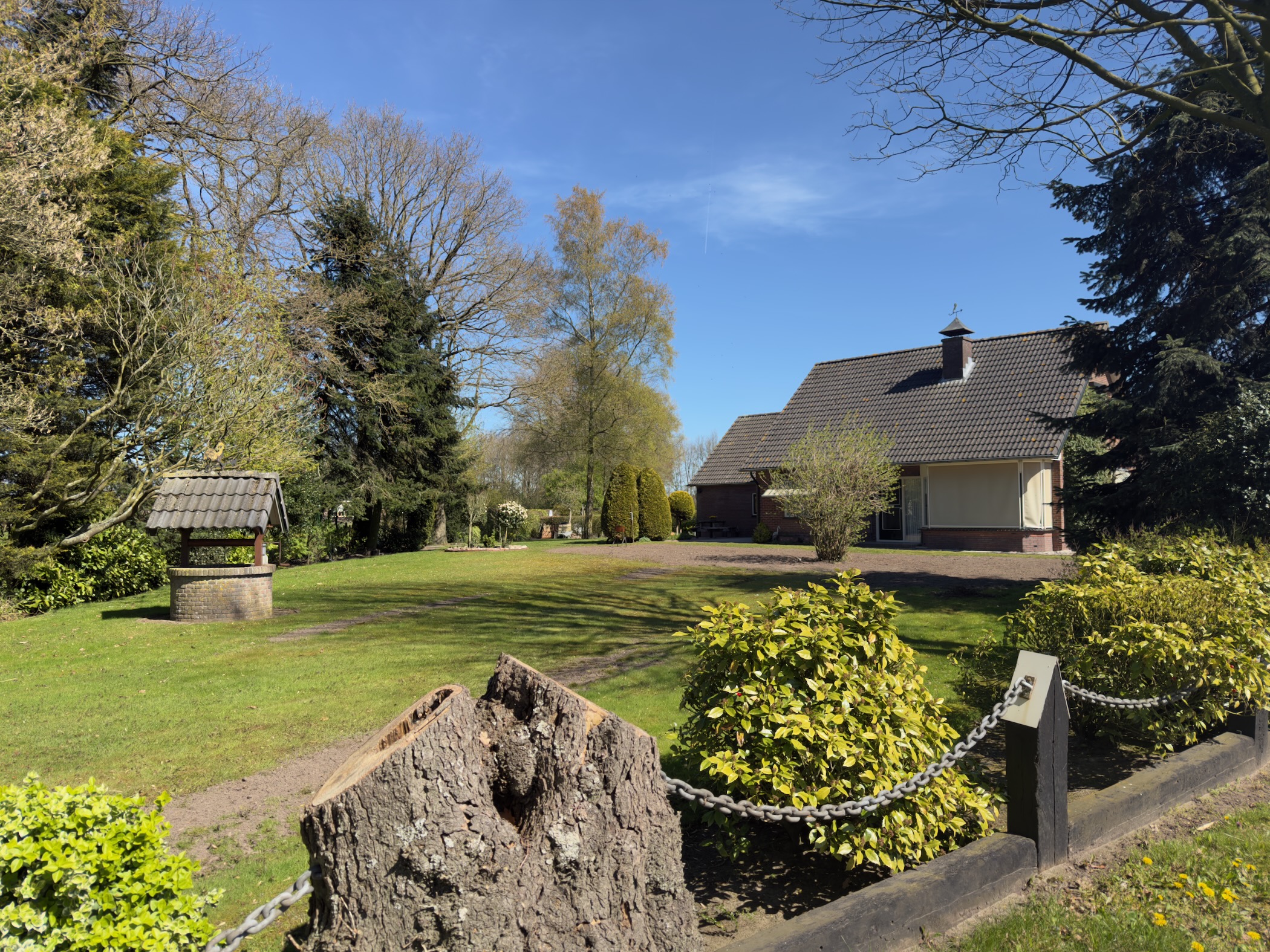 Modern Dutch villa with garden and well in a tranquil rural setting