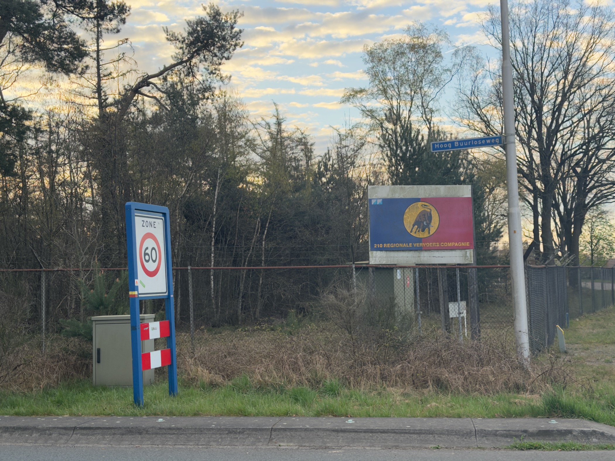 Military base entrance sign and 60 km/h speed zone near Harskamp