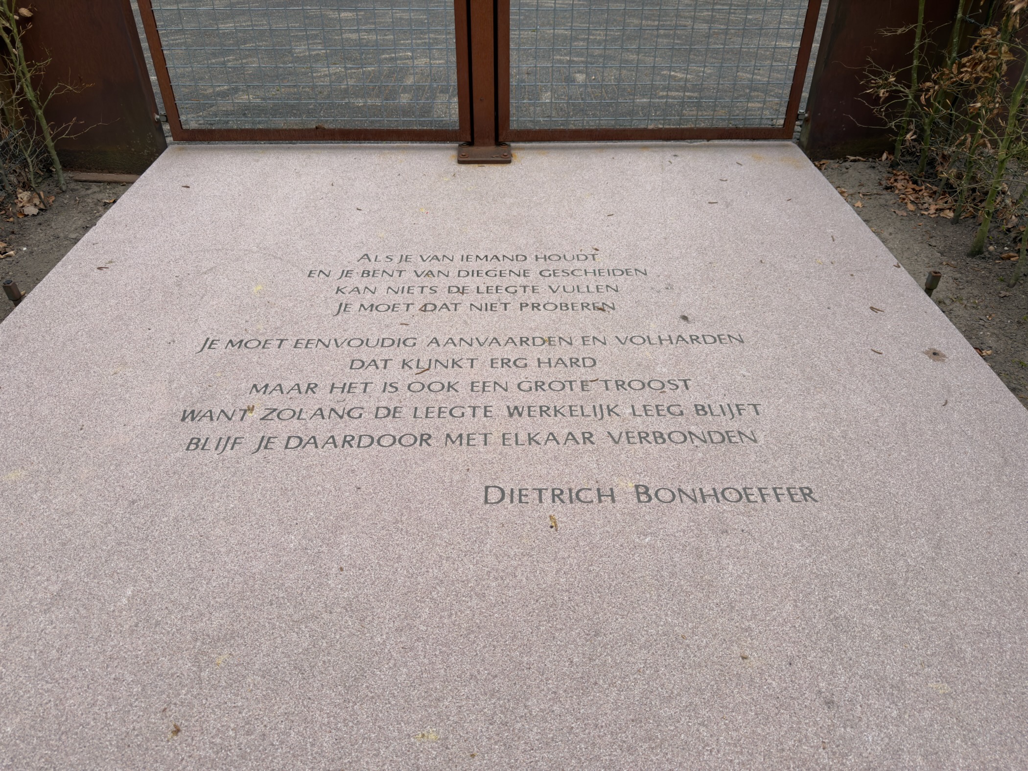 Memorial slab engraved with a Dutch poem by Dietrich Bonhoeffer at Woeste Hoeve
