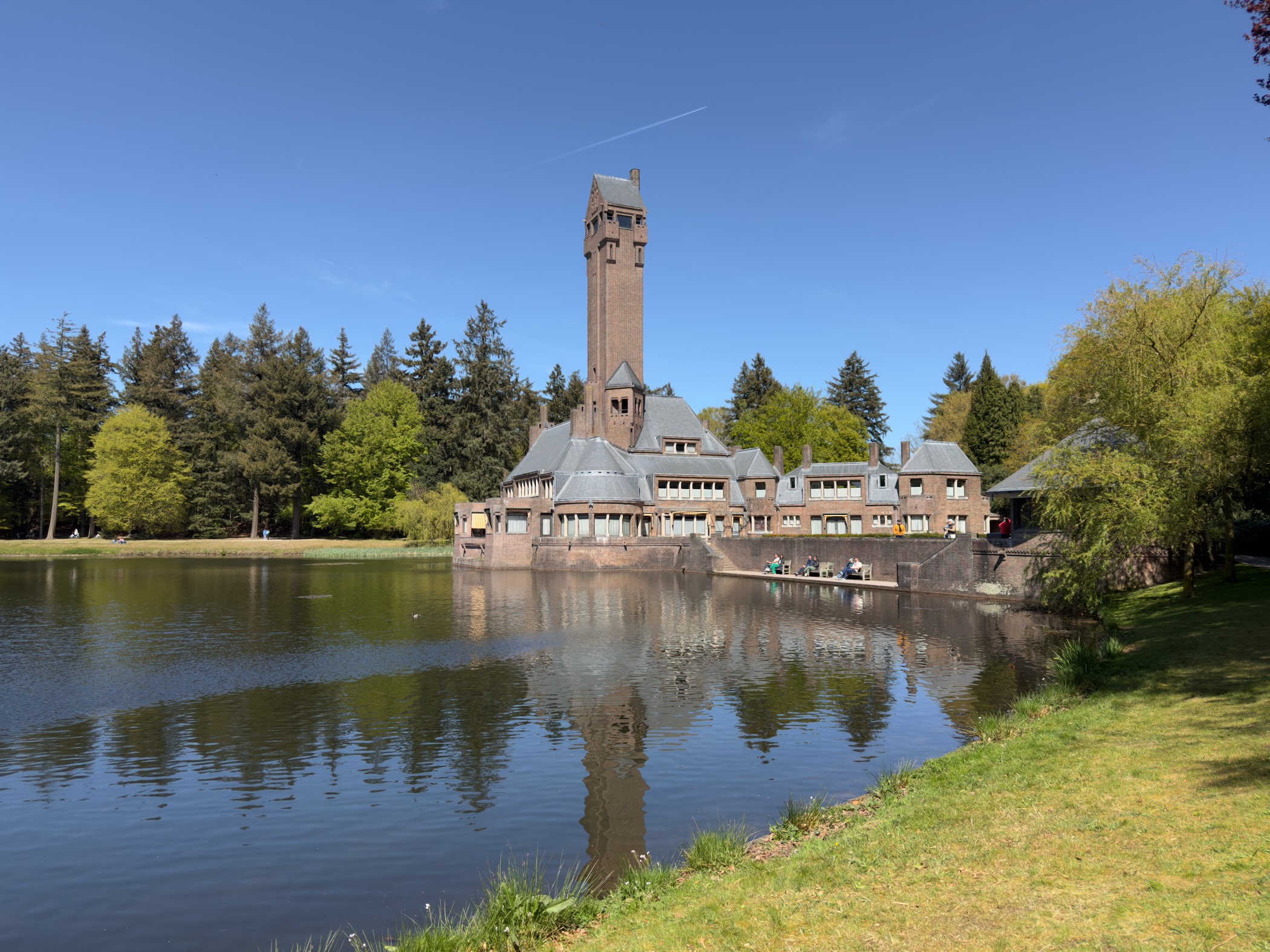 Saint Hubertus lodge and tower reflected in the still pond